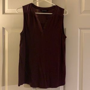 Burgundy tank with mesh fabric across the top in the back.